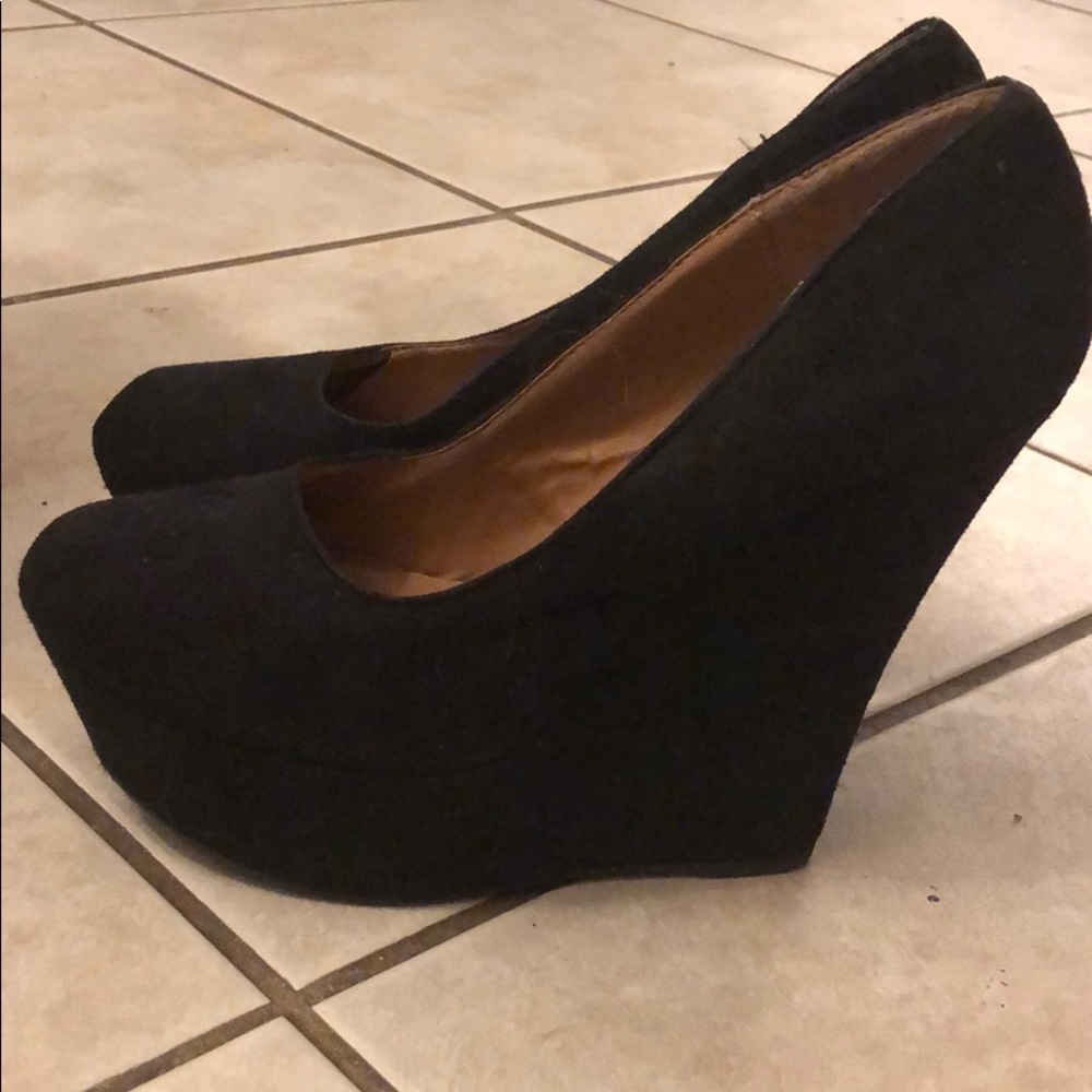 Hardly used black wedge high heel